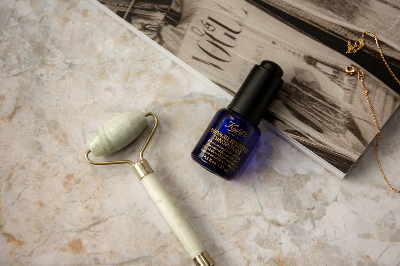 Kiehl's skincare product and a jade roller